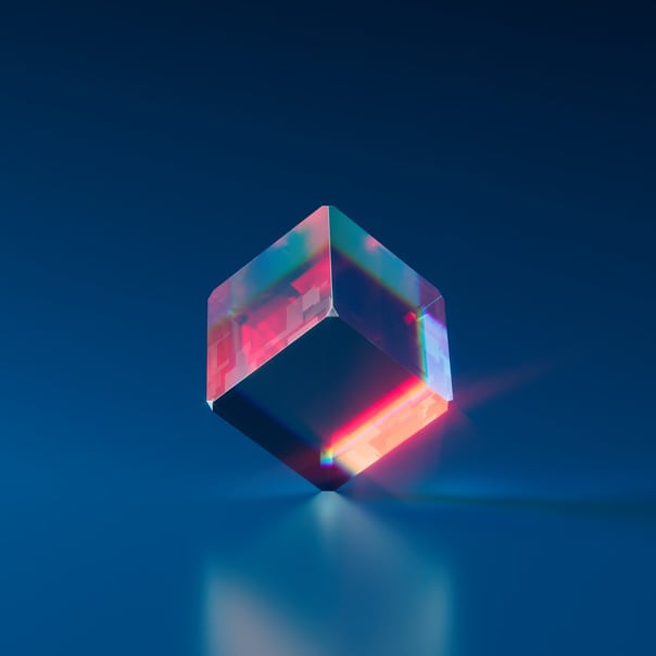 image of cube balanced on a single point